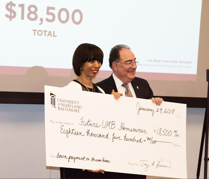 Baltimore Mayor Catherine Pugh praised University of Maryland, Baltimore President Jay A. Perman, MD, for UMB’s commitment to offer an incentive of $16,000, which when combined with a city incentive, would give qualifying employees a total of $18,500 to help buy a home.