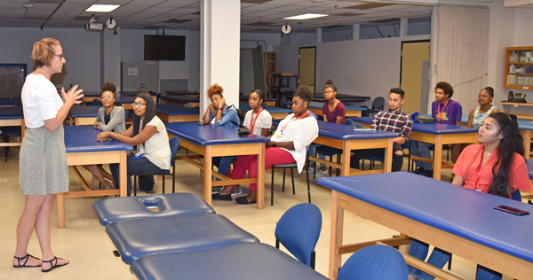 YouthWorks students listen to a physical therapy lecture at the School of Medicine.