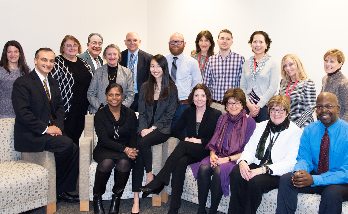 UMB President Jay A. Perman, MD, and School of Nursing Dean Jane M. Kirschling, PhD, RN, FAAN, director of the UMB Center for Interprofessional Education (IPE), fourth and fifth from left, with other leaders of the center and faculty members who were recipients of IPE seed grants.