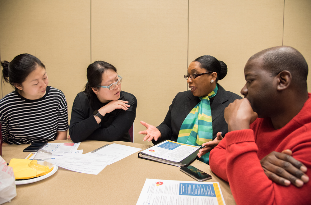 TaShara C. Bailey, PhD, MA, interim curriculum coordinator of the UMB CURE Scholars Program and an adjunct faculty member of the Graduate School, second from right, adds her voice to a discussion of UMB's campus climate for diversity. 