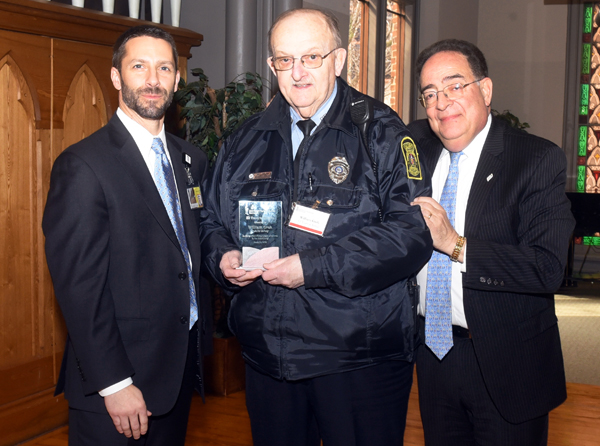 Officer William Groh of the Public Safety team, who came to UMB in 1964, was honored for his years of service by Matt Lasecki, SPHR, chief Human Resources officer, and President Jay A. Perman, MD. 