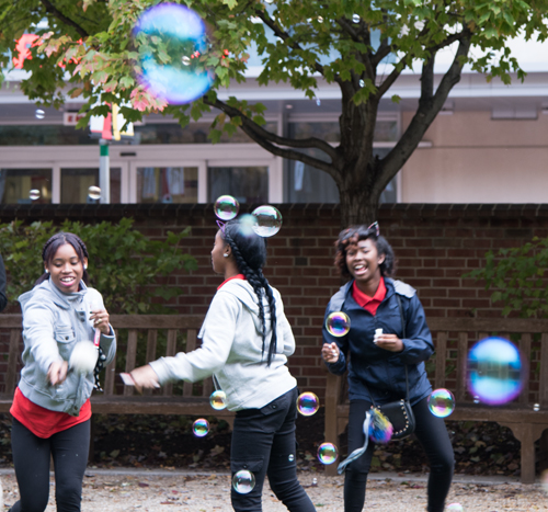 As an environmentally friendly alternative to releasing balloons, students from Edmondson-Westside High School have fun blowing bubbles to symbolize the launch of future health careers.