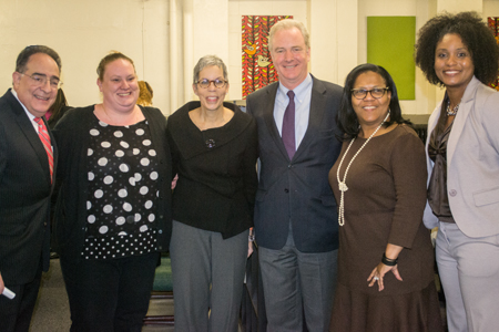U.S. Rep. Chris Van Hollen of Maryland, third from right; joins UMB President Jay A. Perman, MD, left; the Family League of Baltimore's senior director of initiatives Julia Baez; Promise Heights executive director and SSW assistant dean Bronwyn Mayden, MSW; The Historic Samuel Coleridge-Taylor Elementary School principal Bettye Adams, and vice principal Twanda Pickett.