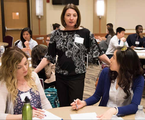Heather Congdon, PharmD, BCPS, CDE, of the School of Pharmacy (SOP) mentors students Amanda Daugherty, right, of the School of Medicine’s Physical Therapy and Rehabilitation Science program and Christine Do (SOP).