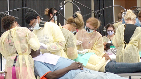 UM School of Dentistry students provide free dental care under the supervision of SOD faculty at the Mission of Mercy at Project Homeless Connect.