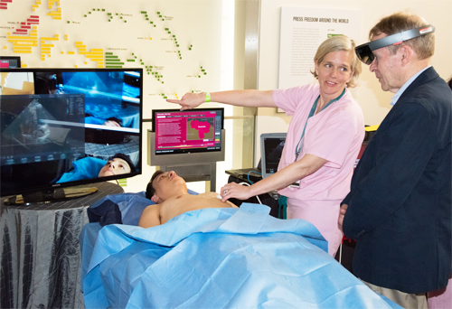 Sarah Murthi, MD explains the augmented reality technology used to perform an ultrasound scan on volunteer 