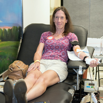 Melissa Regan donates in honor of Lamont Roberson at the blood drive held in his name.