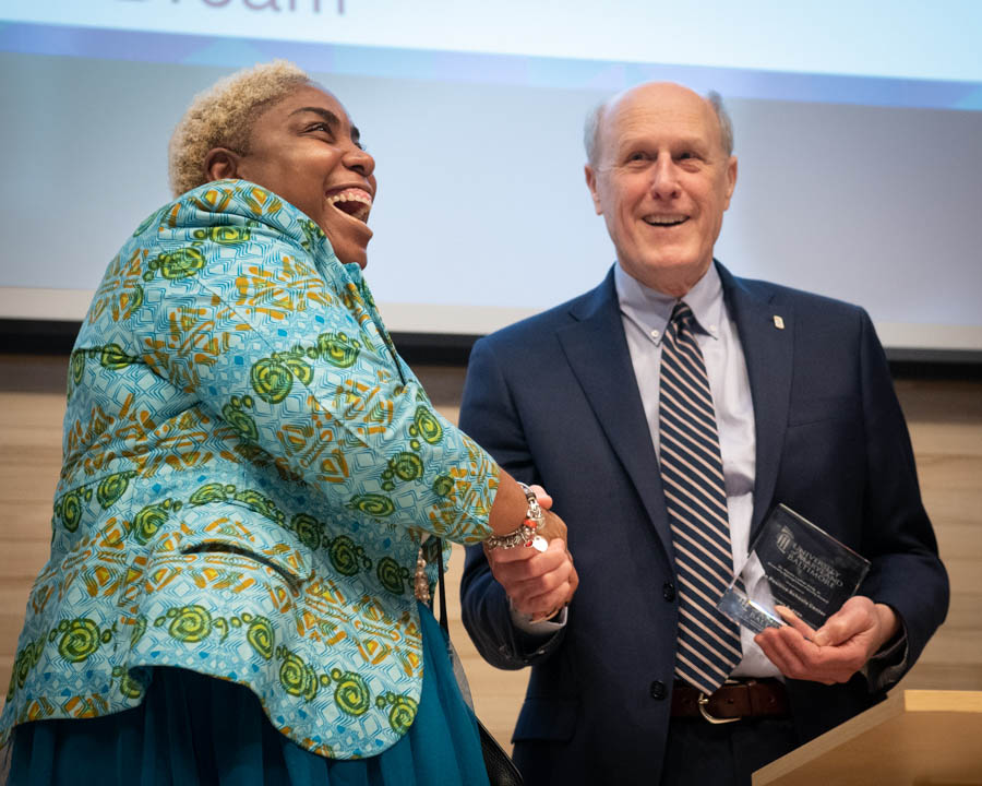 Shantay McKinily, MEd, director of the Positive Schools Center, accepts the Diversity Recognition Award for Outstanding UMB Faculty/Unit from UMB Interim President Bruce E. Jarrell, MD, FACS.