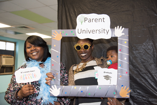 From left, Judy Center Family Coordinator Kimberly Dudley, (left) joins Parent University graduate Tawanda Thompson and her son, DeShaun, in a fun photo at the Parent University graduation ceremony.
