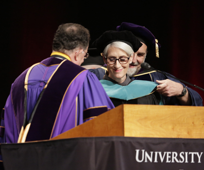 Wendy R. Sherman, MSW ’76, receives an honorary degree from SSW Dean Richard P. Barth, PhD, MSW, as President Jay A. Perman, MD, presides during 2016 Commencement ceremonies.