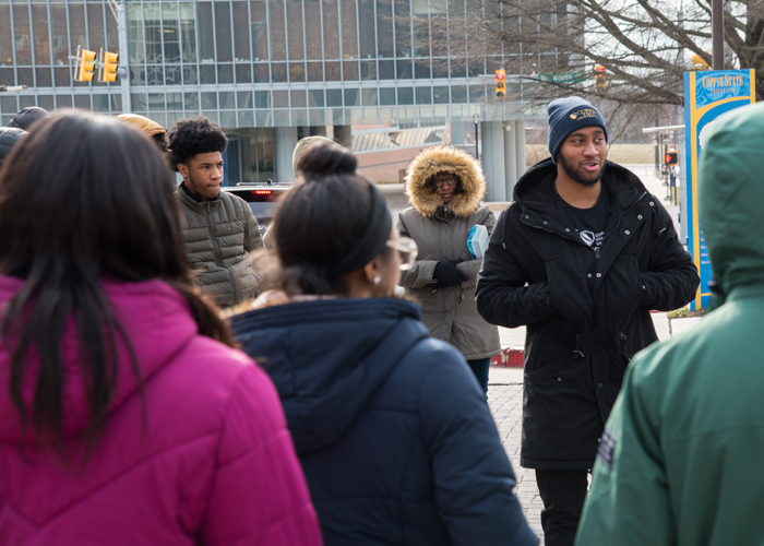 Marcus Edwards, a CSU admissions counselor and CSU alumnus, took the CURE scholars on a private tour of Coppin State University.