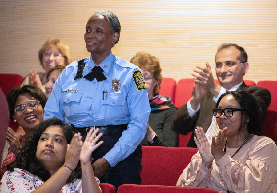 UMB security officer Evelyn Greenhill is applauded during the speech for the impact she is making as a mentor in the UMB CURE Scholars Program.