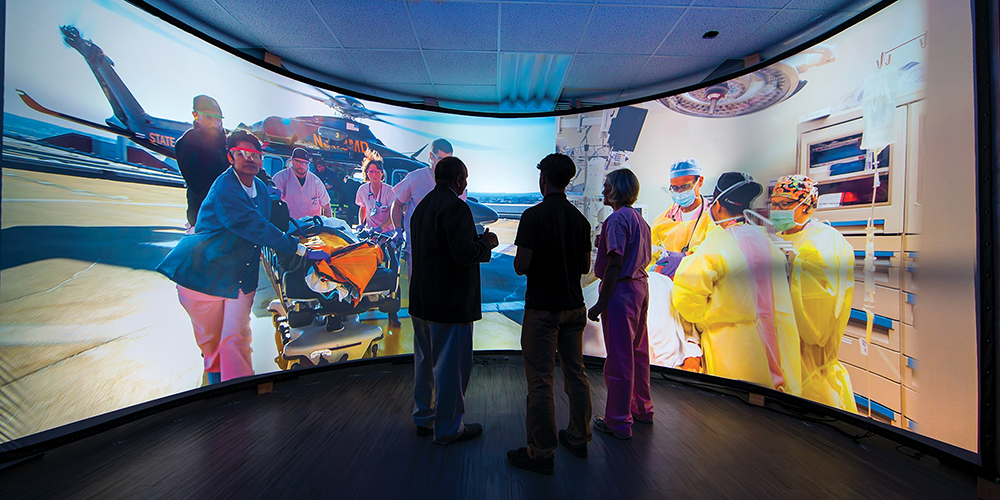 People surrounded by screen with medical providers