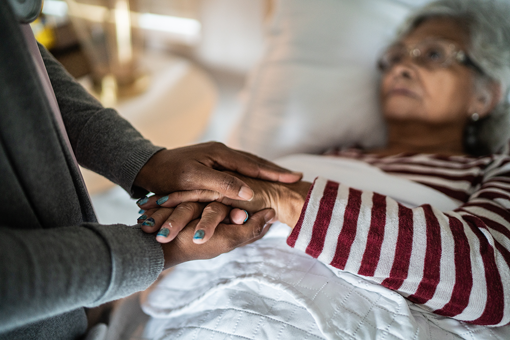 A older woman laying in bed
