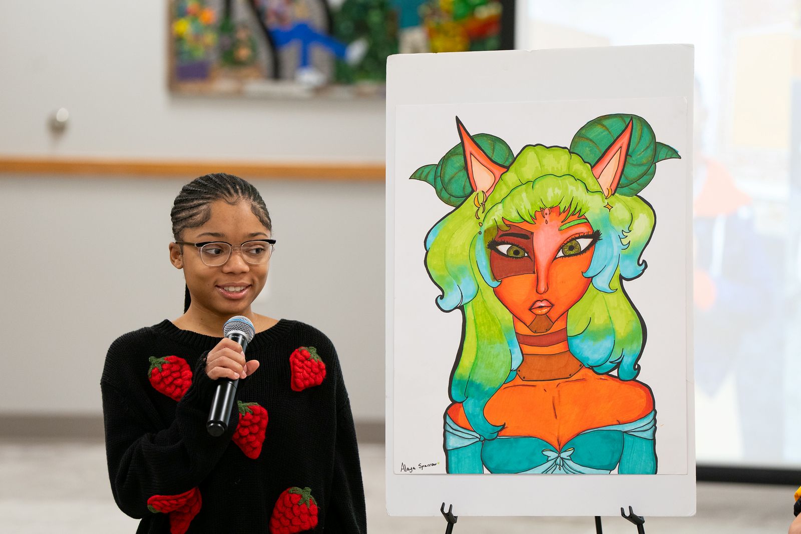 Student Alaya Sparrow presenting her art.
