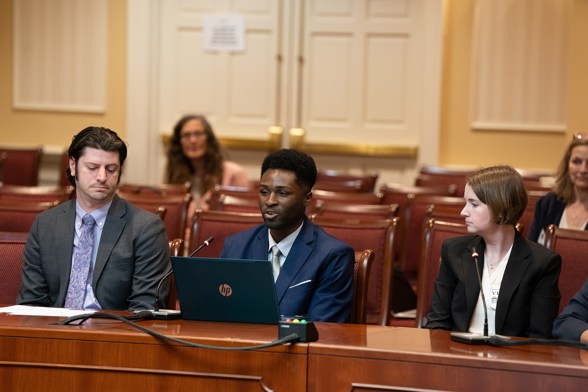 Davon Nixon '26 (center), testifying before a Maryland Senate committee