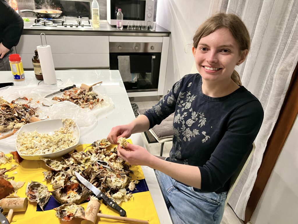 Woman picking steamed crabs