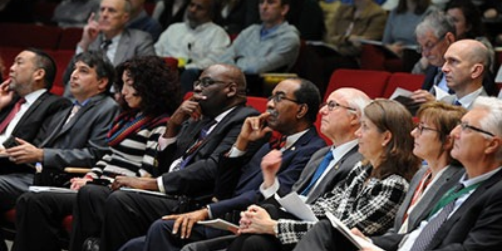 UMB School of Medicine leaders listen to a speaker at the Festival of Science