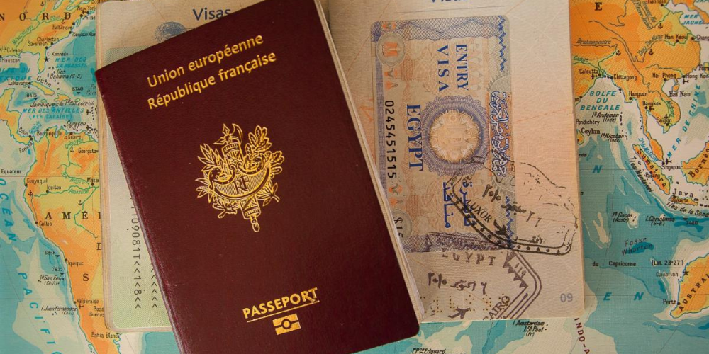 Passports sit on top of a map