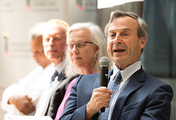 UMSOM Professor Gary Weintraub (rights) speaks at a 2023 event to announced the Kahlert Institute
