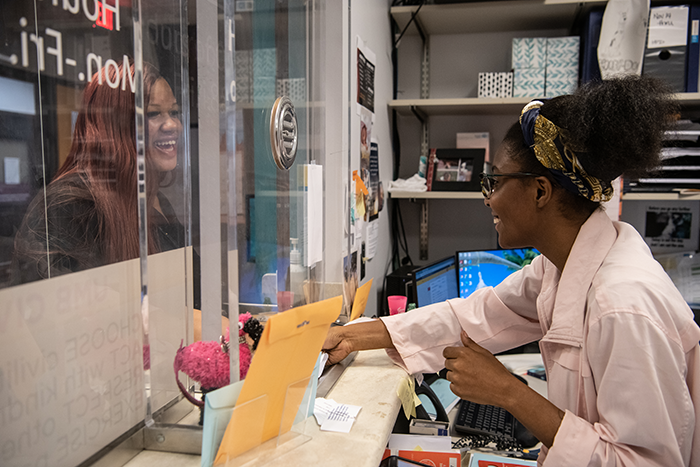 A person interacting with a customer