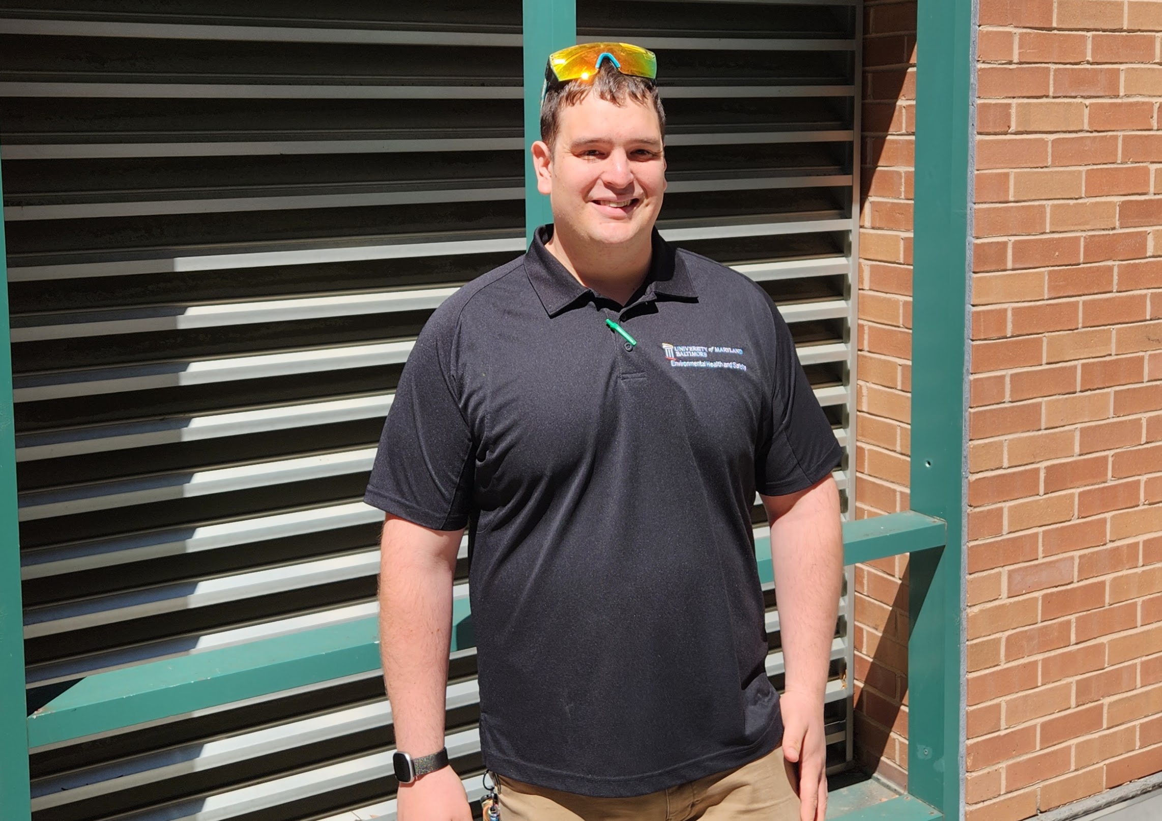 Michael Miklewski poses outside a building
