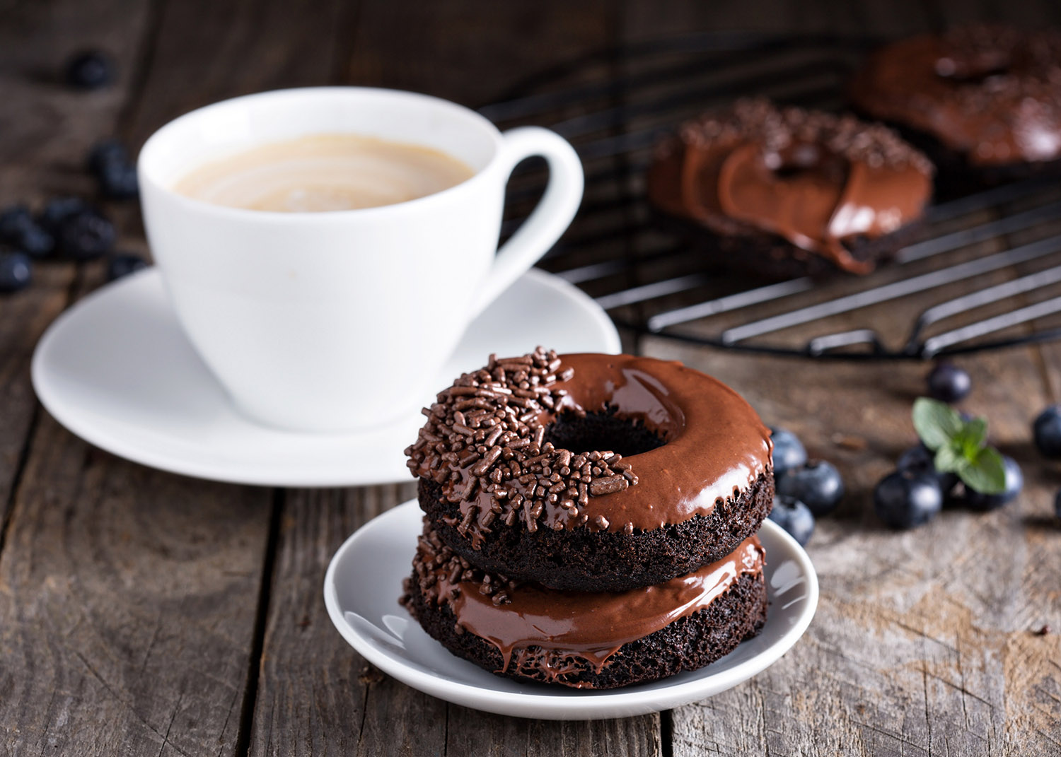 chocolate donut and cup of coffee