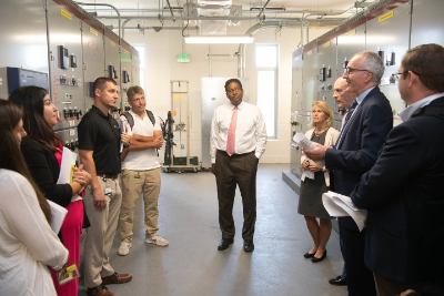 group of people on tour of north campus electrical substation