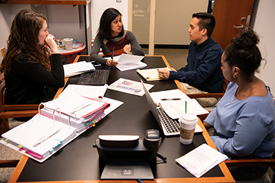 Students gathered around the table