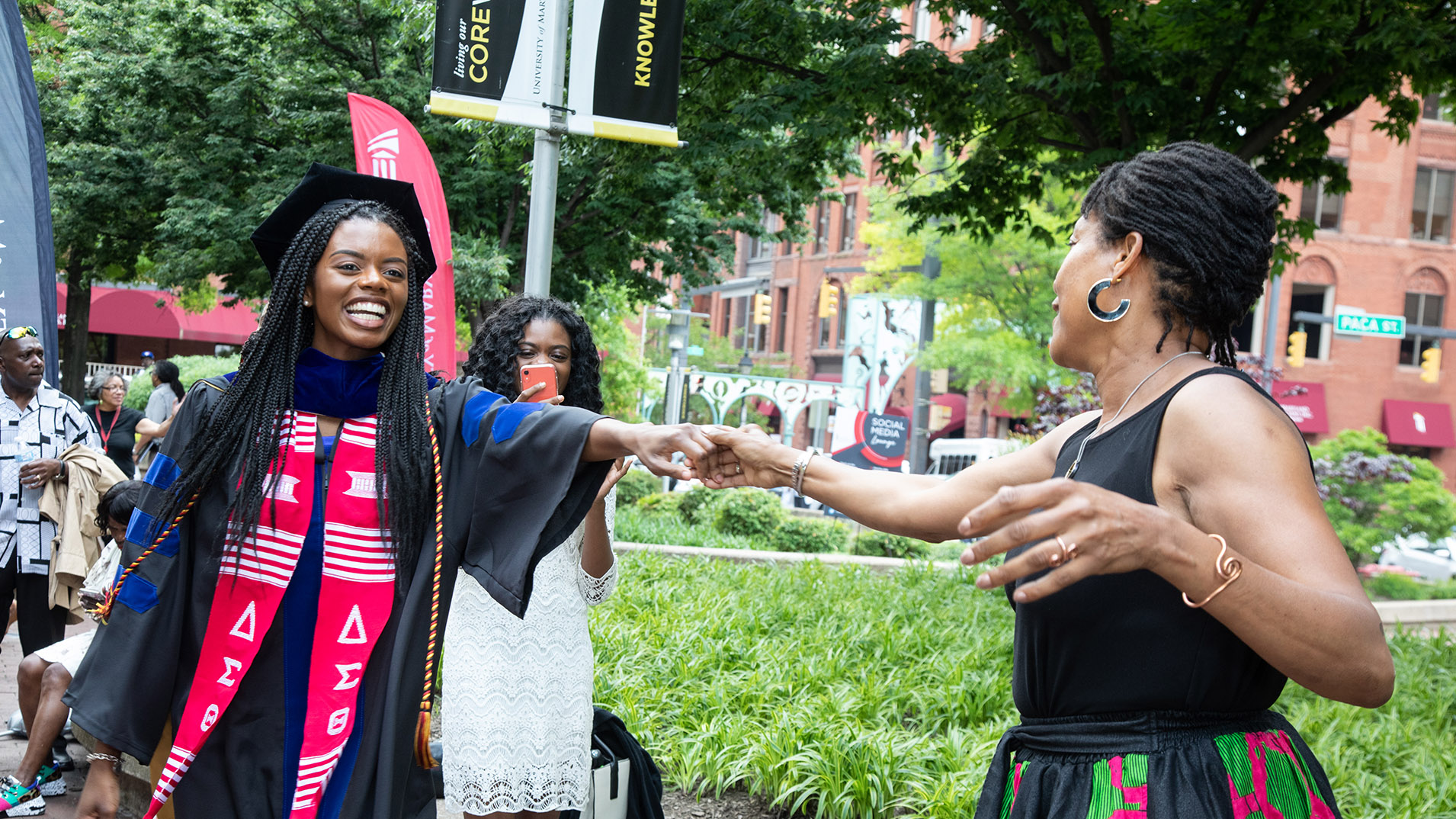 Student and family member celebrating at commencement