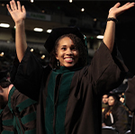 Student cheering for graduating in the UMB class of 2018