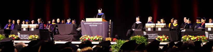 Speakers and Honorees from UMB Commencement 2018 sitting down and giving speeches to the graduating class