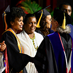 School of nursing students shaking hands for graduation