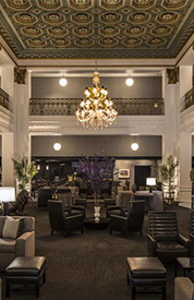 Lord Baltimore Hotel waiting area with dim lights and multiple seating arrangements