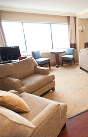 Radisson Baltimore room during the day time with multiple seating arrangements in a bedroom