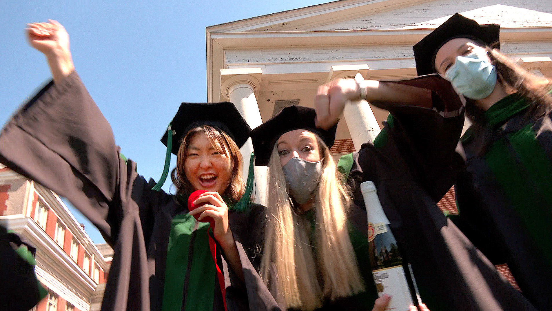 School of Medicine graduates celebrating outside