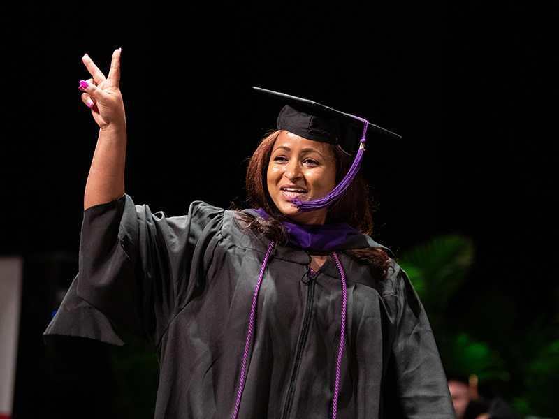 Francis King Carey School of Law student holding up the 