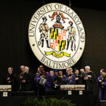 Honorary degree recipients receiving their degree onstage
