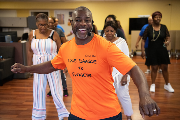 instructor teaching line dancing class