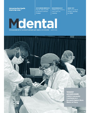 dental school alumni magazine cover showing dental procedure