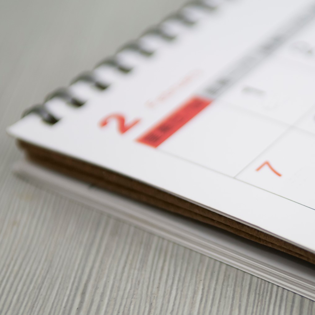 A planner calendar placed on a desk