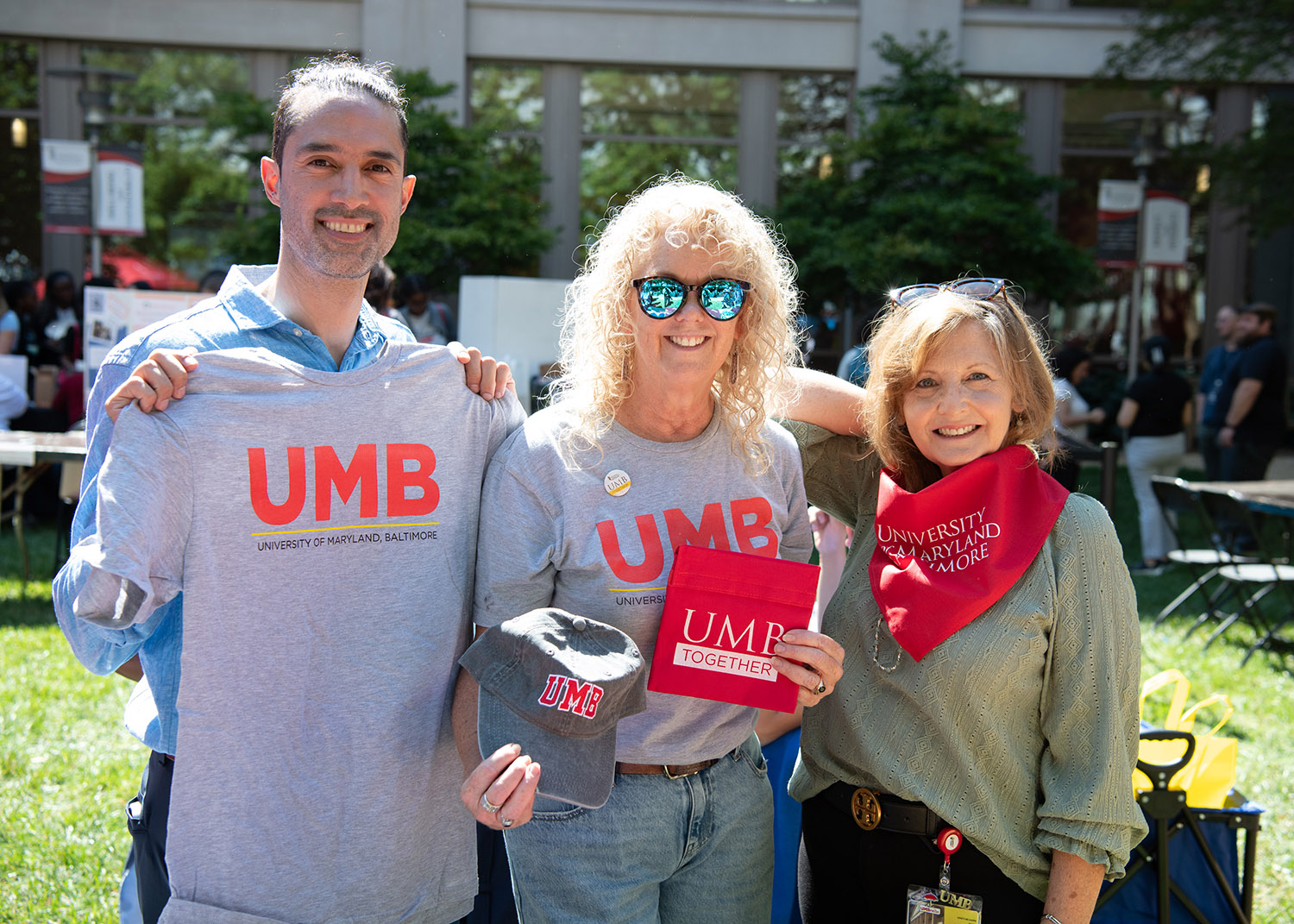 OCPA staff display UMB swag at Fall Fest