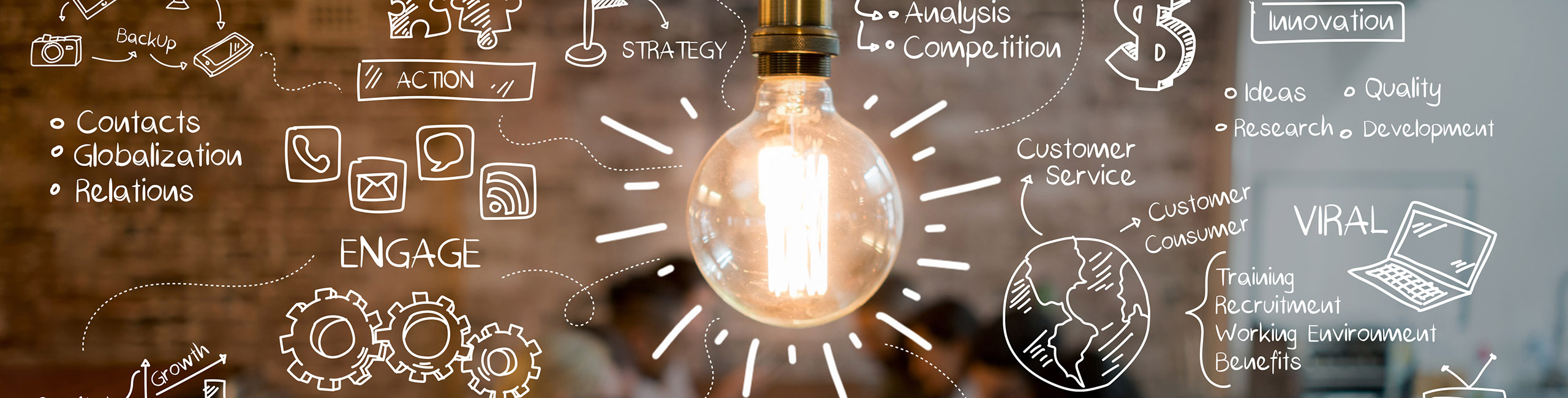 image of a lightbulb with marketing ideas and concepts written in white handwriting all around it