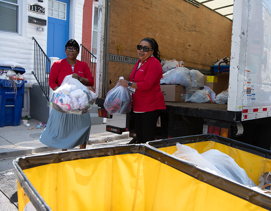 Eris Smith (left) and Saifa Poole deliver donations to Saint Paul's Place, delivered by UMBPACE