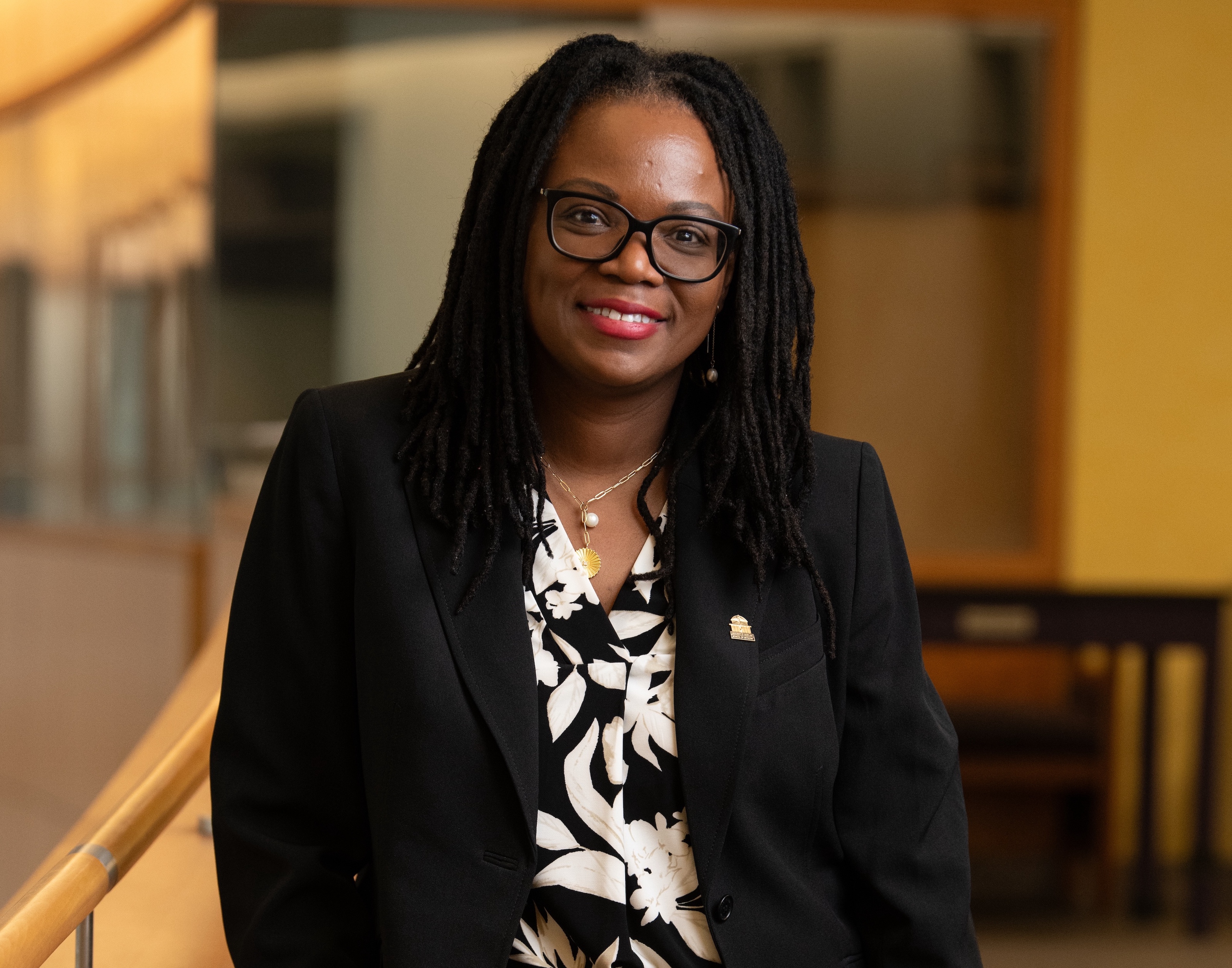 Woan in black suit jacket