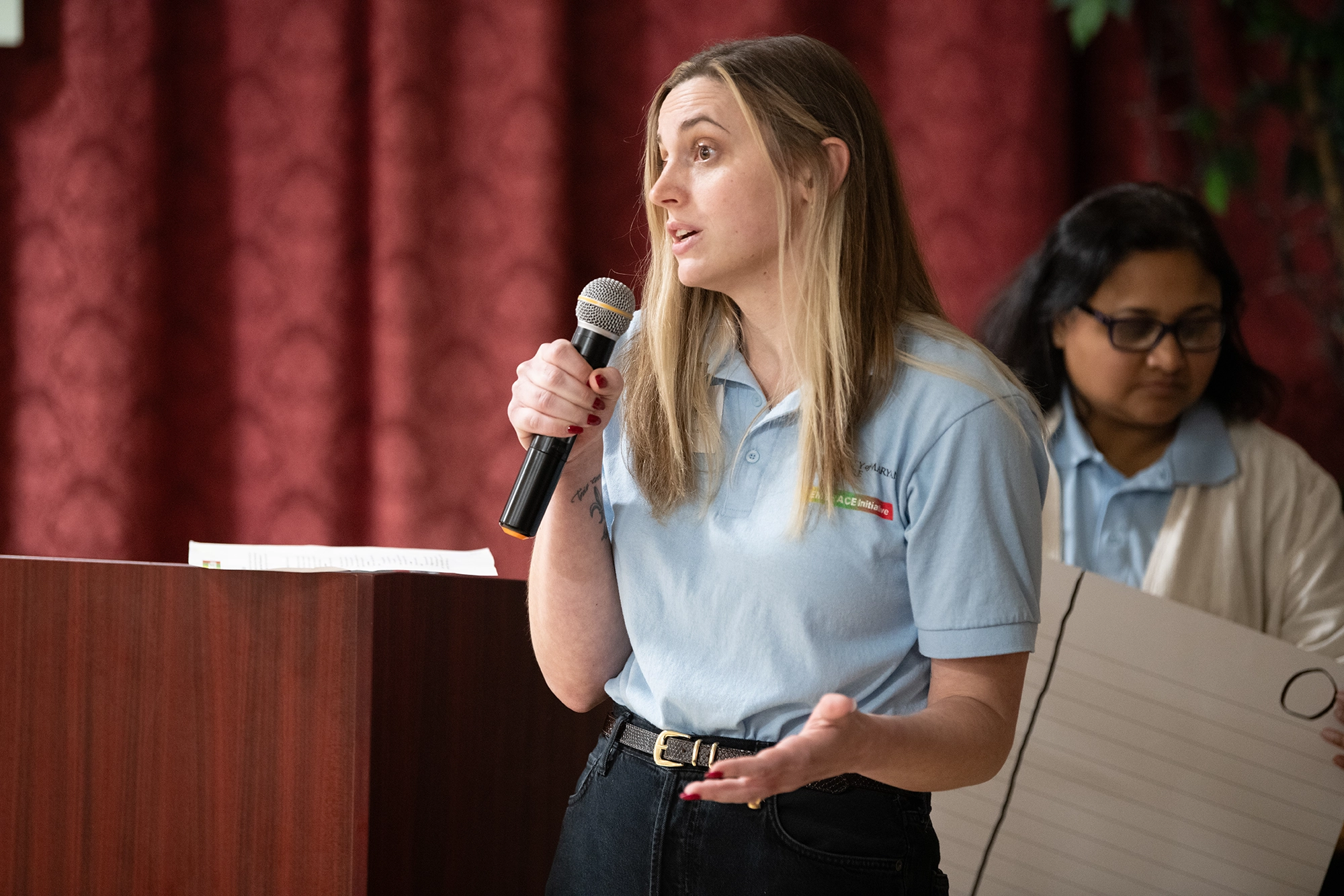 An EMBRACE staff member speaking at a community event