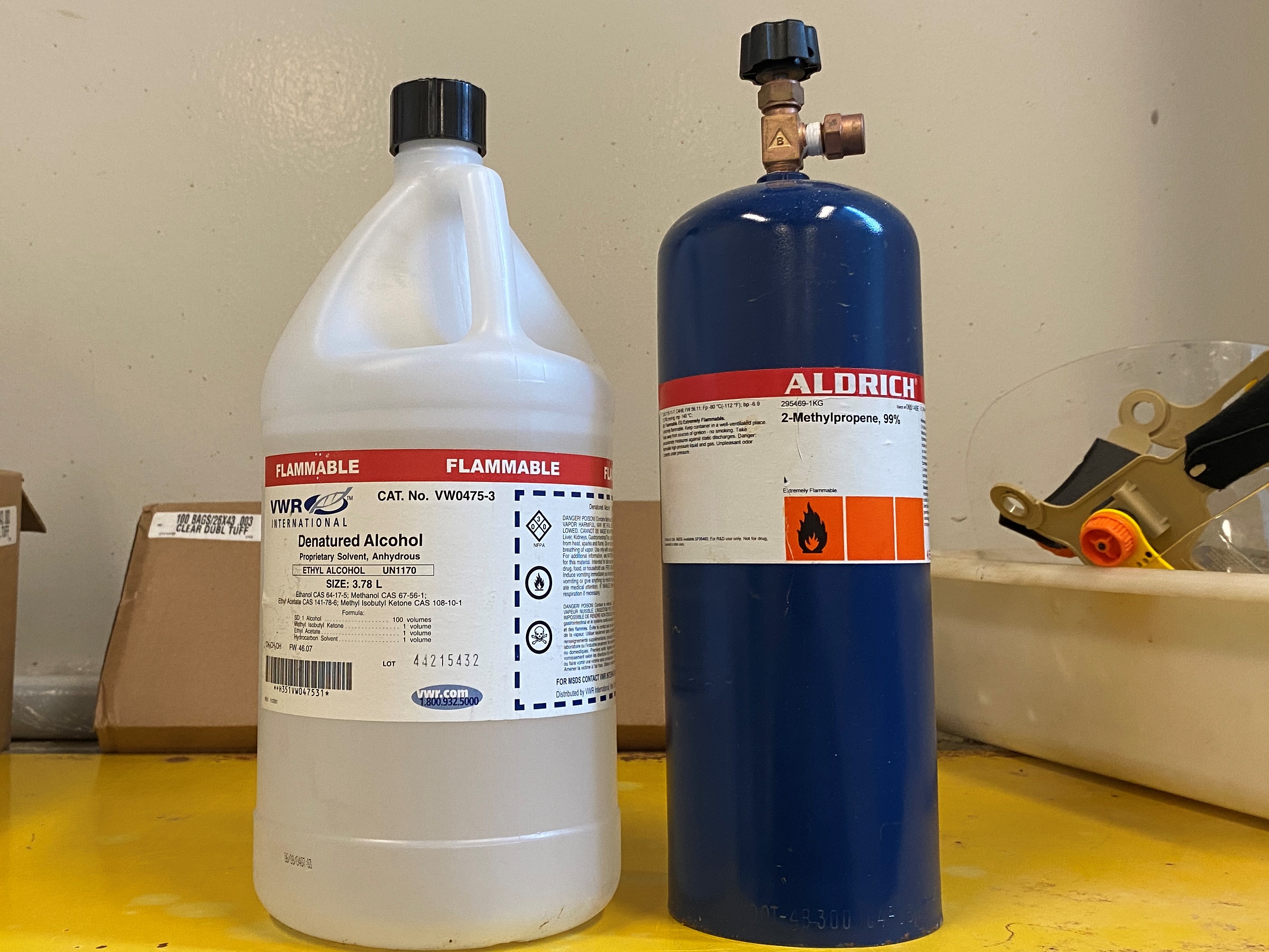 Flammable chemicals sitting on top of a flammable storage cabinet.