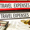 Binders labelled Travel Expenses