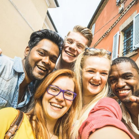 Five students pose for a selfie