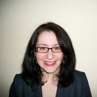 Headshot of a woman in a suit jacket